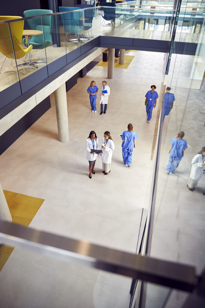 overhead shot of two female medical staff in white 2024 10 21 12 17 10 utc